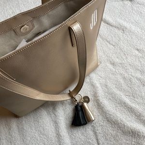 Mark and graham gold purse.